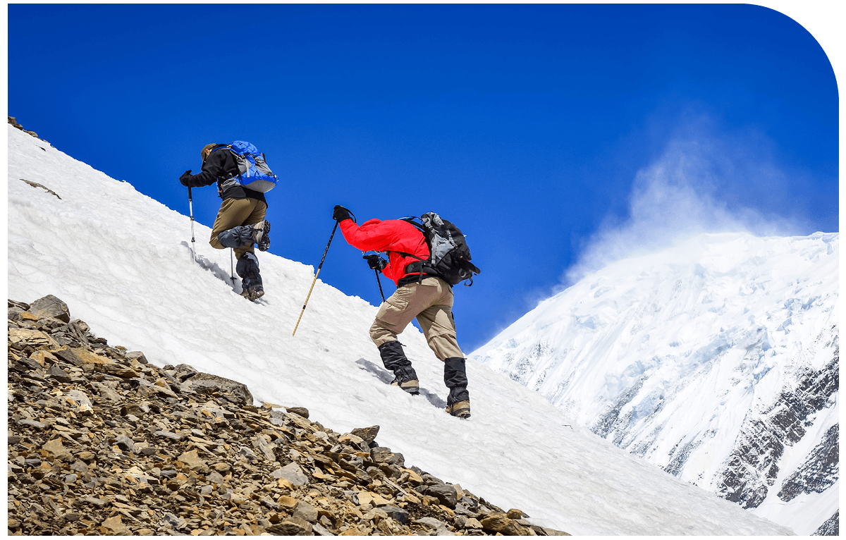 climbers ascending a snowy mountain