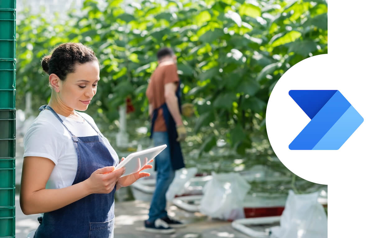 woman checking tablet in agricultural scene