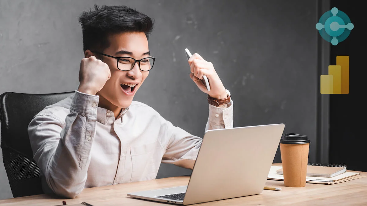 excited man working on laptop