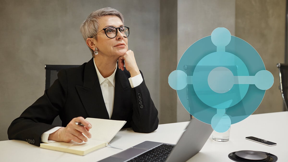 woman pondering at desk with Business Central Logo