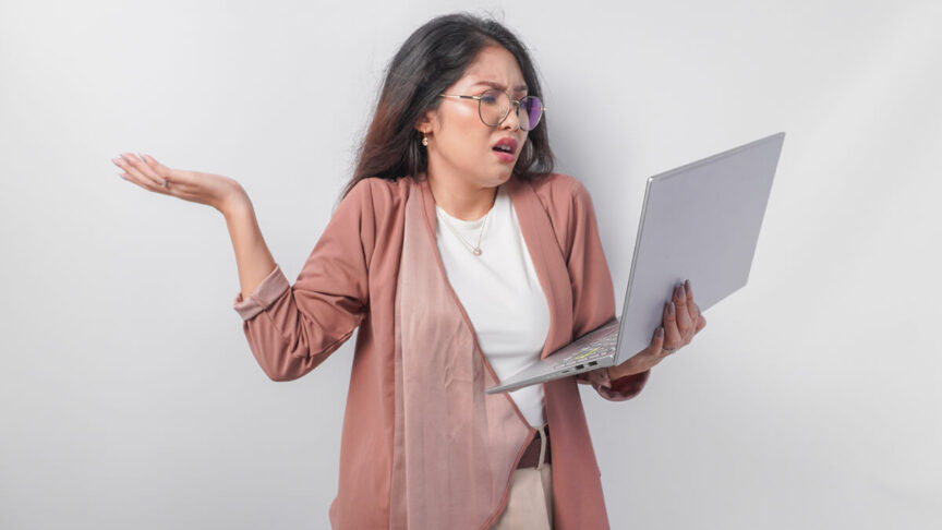 Futrated Person holding a laptop and raising one hand